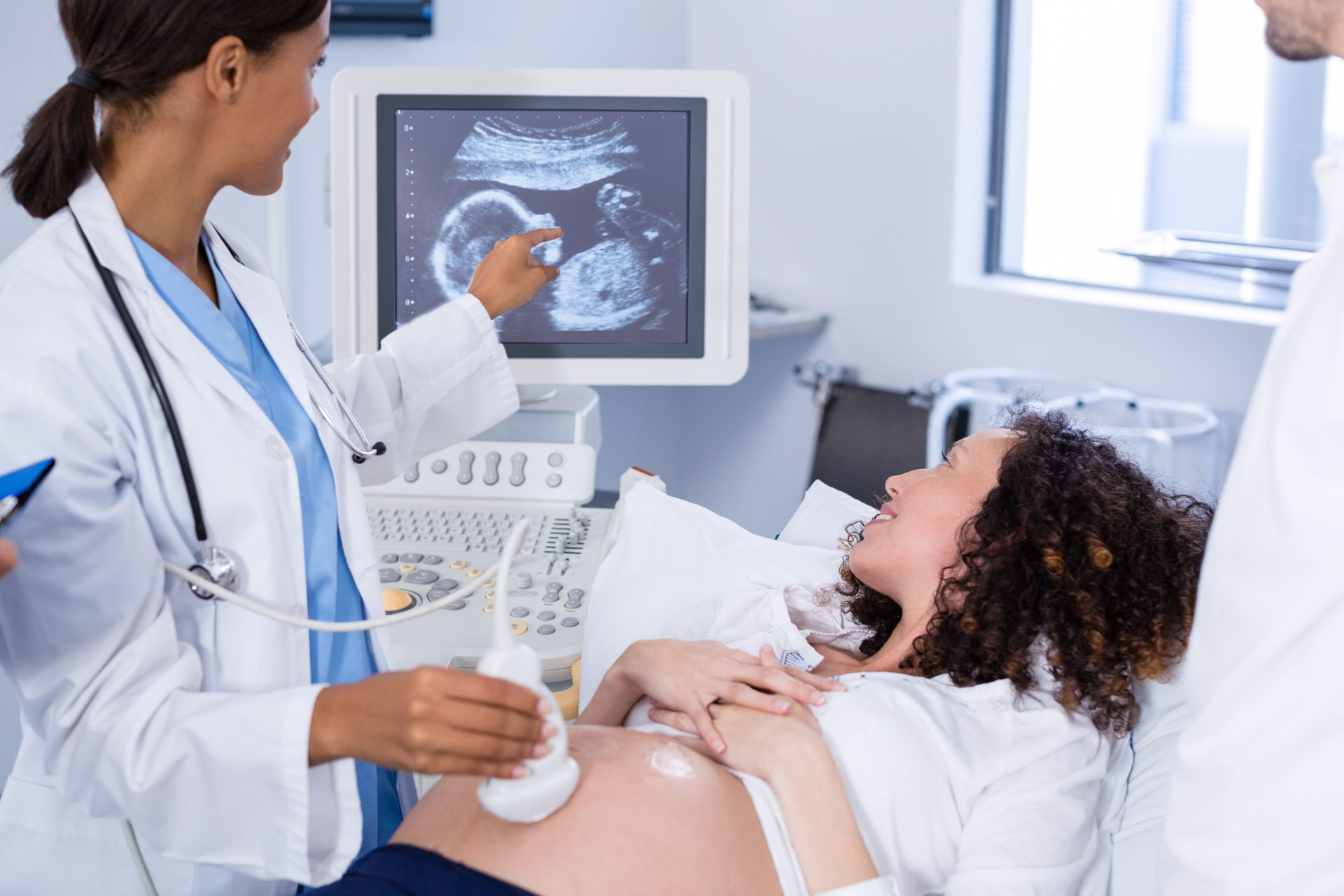 Doctor administering a sonogram 
