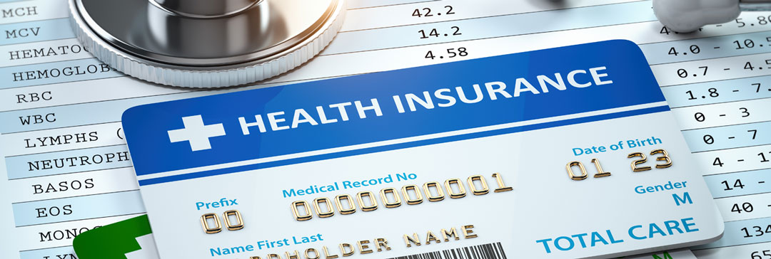 Health Insurance card sitting on a medical bill